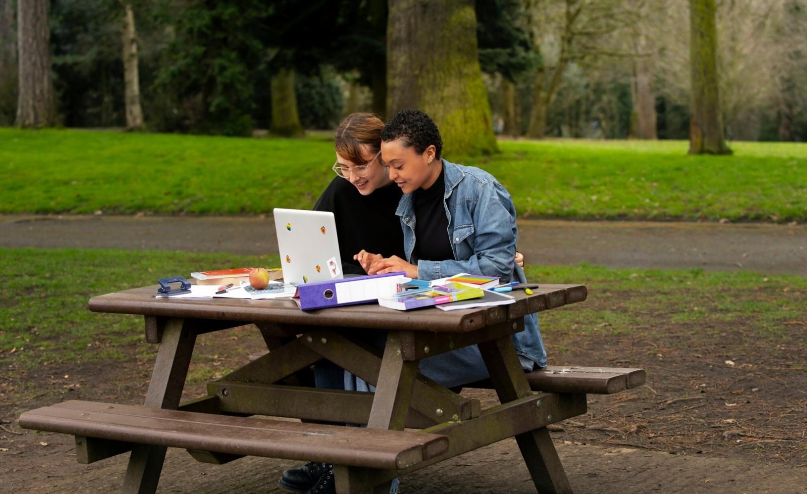 Professional remote learning setup with dual monitors and financial charts
