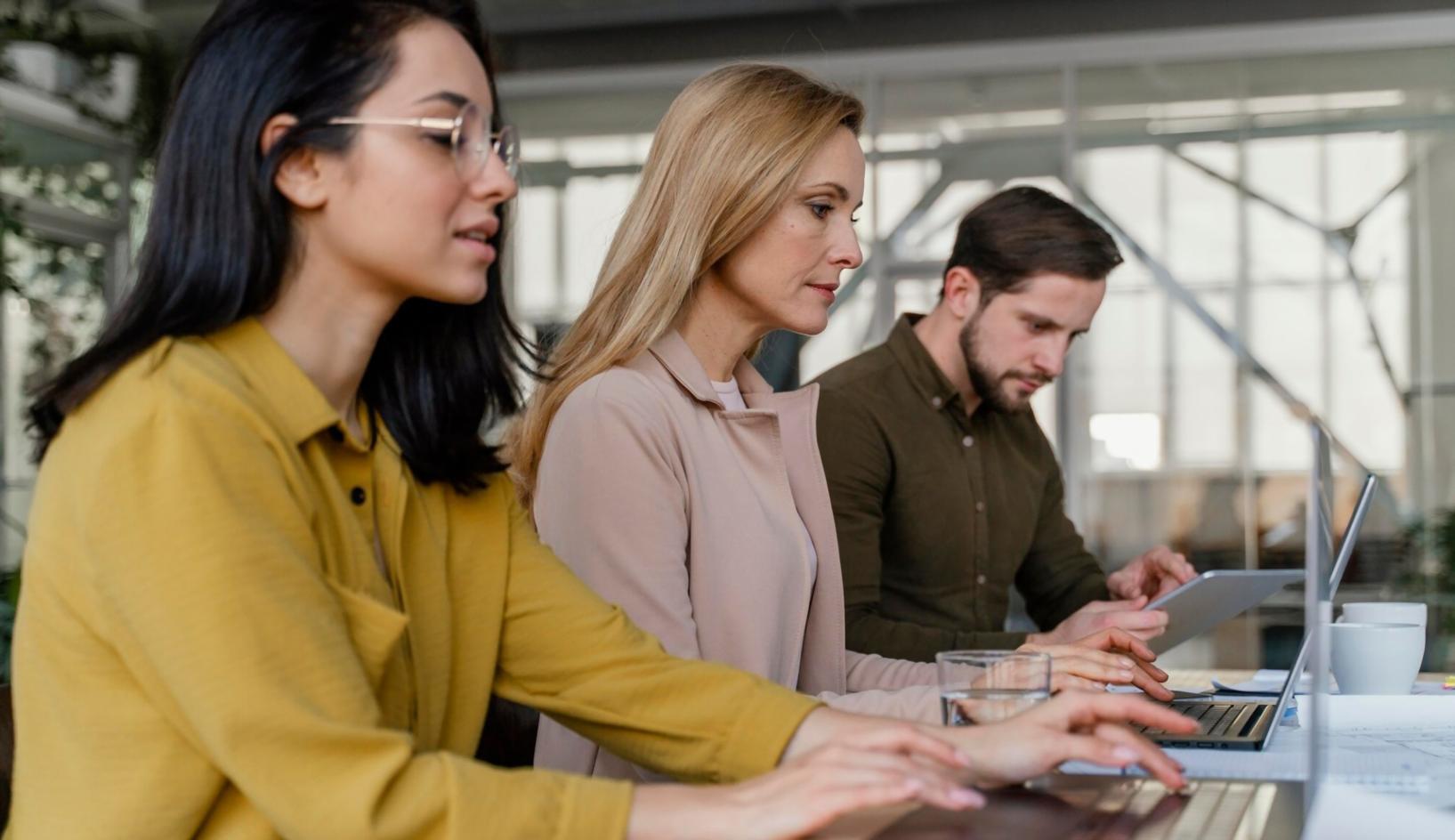Team collaborating on financial technology solutions in modern office environment